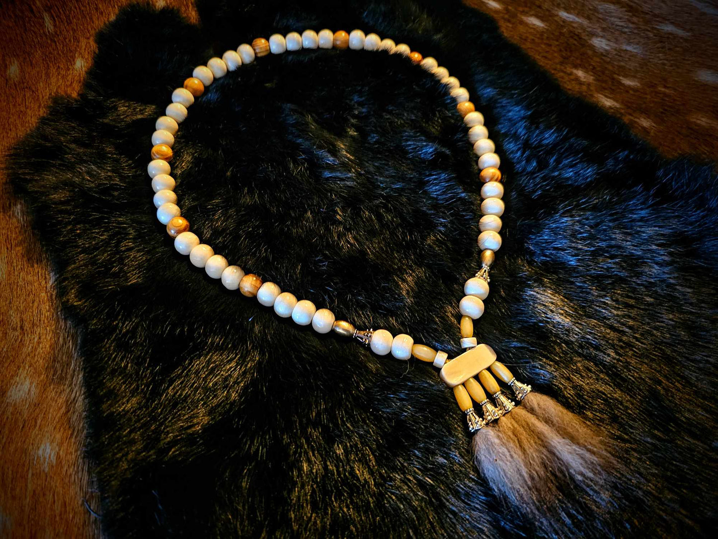 Wolf Fur Pendant with Bison, Cow, Wood, and Metal Beads