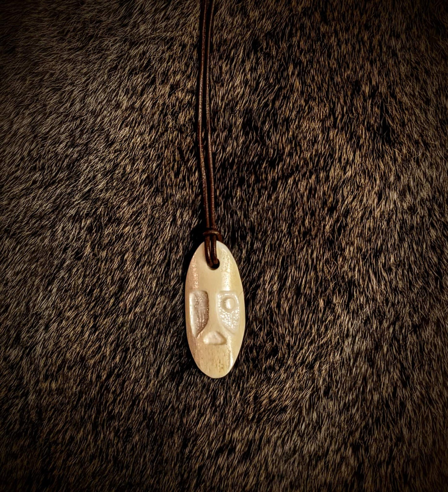 Primitive Hand Carved Elk Bone Odin Pendant