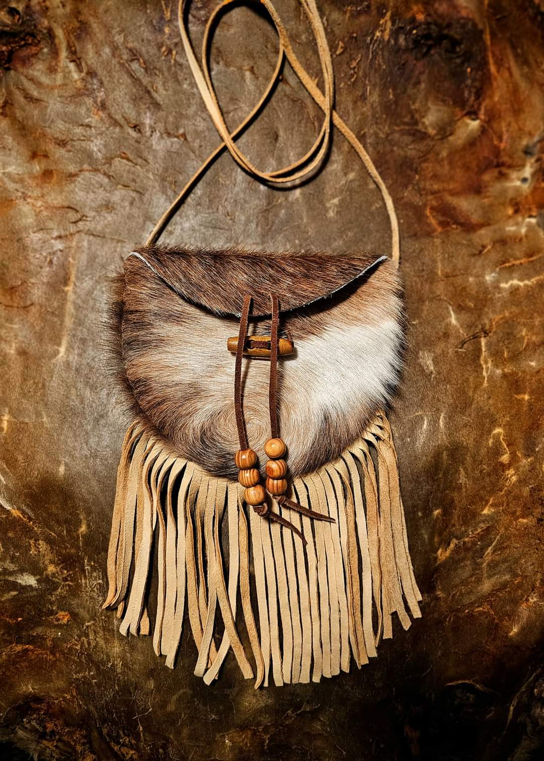 Handmade Cowhide Bag | Round Bag With Wood Toggle and Fringe | Hair On