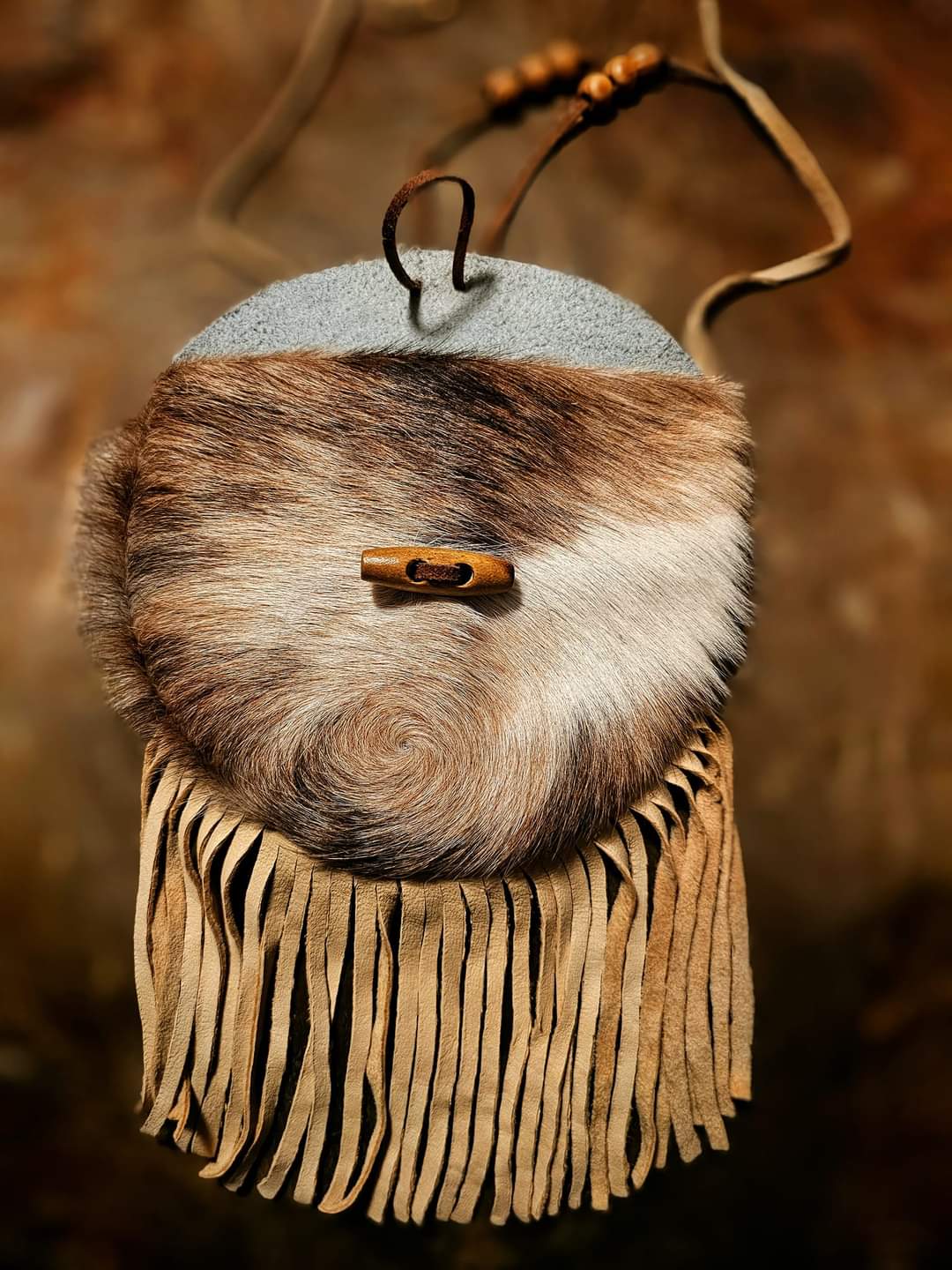 Handmade Cowhide Bag | Round Bag With Wood Toggle and Fringe | Hair On