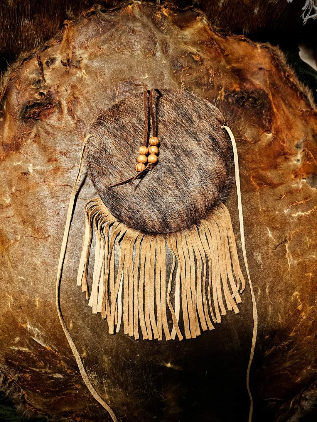 Handmade Cowhide Bag | Round Bag With Wood Toggle and Fringe | Hair On