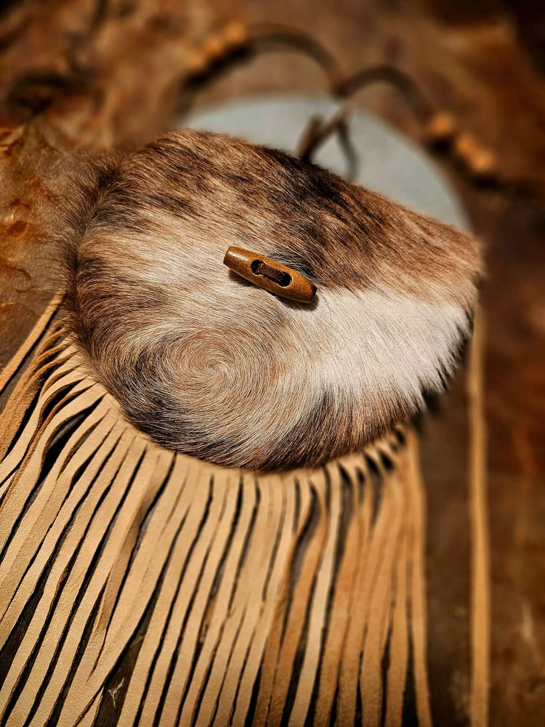 Handmade Cowhide Bag | Round Bag With Wood Toggle and Fringe | Hair On