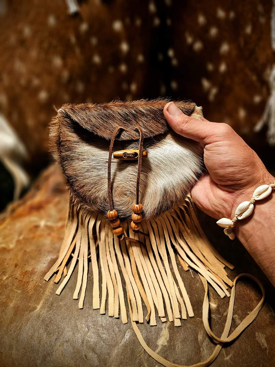 Handmade Cowhide Bag | Round Bag With Wood Toggle and Fringe | Hair On