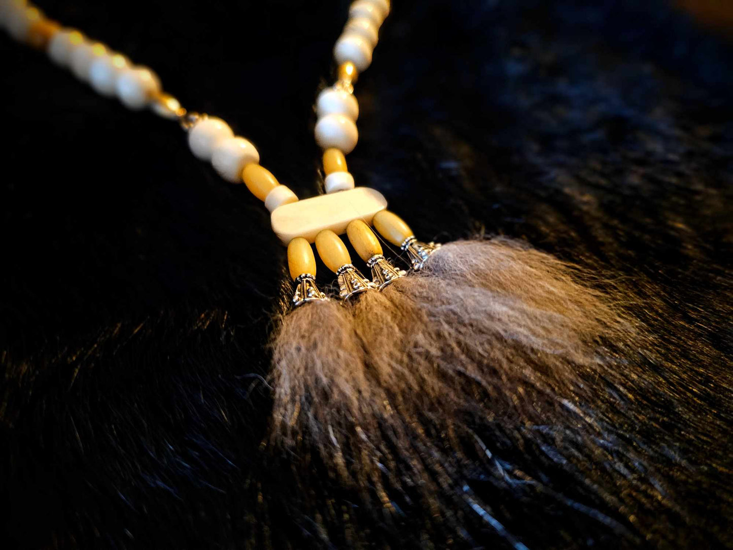 Wolf Fur Pendant with Bison, Cow, Wood, and Metal Beads